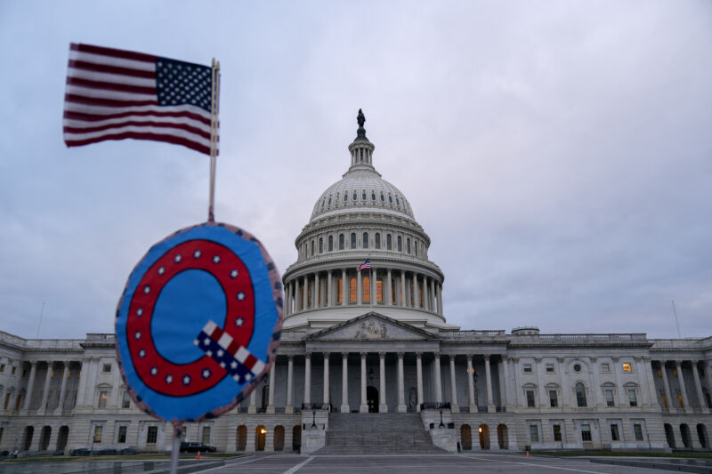 A demonstrator holds a Q sign outside the U.S. Capitol in Washington, D.C., U.S., on Wednesday, Jan. 6, 2021. 